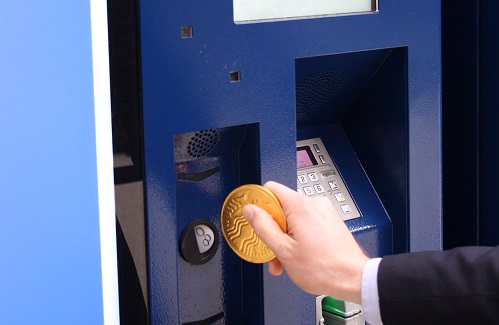 Purchasing a ticket using a chocolate coin