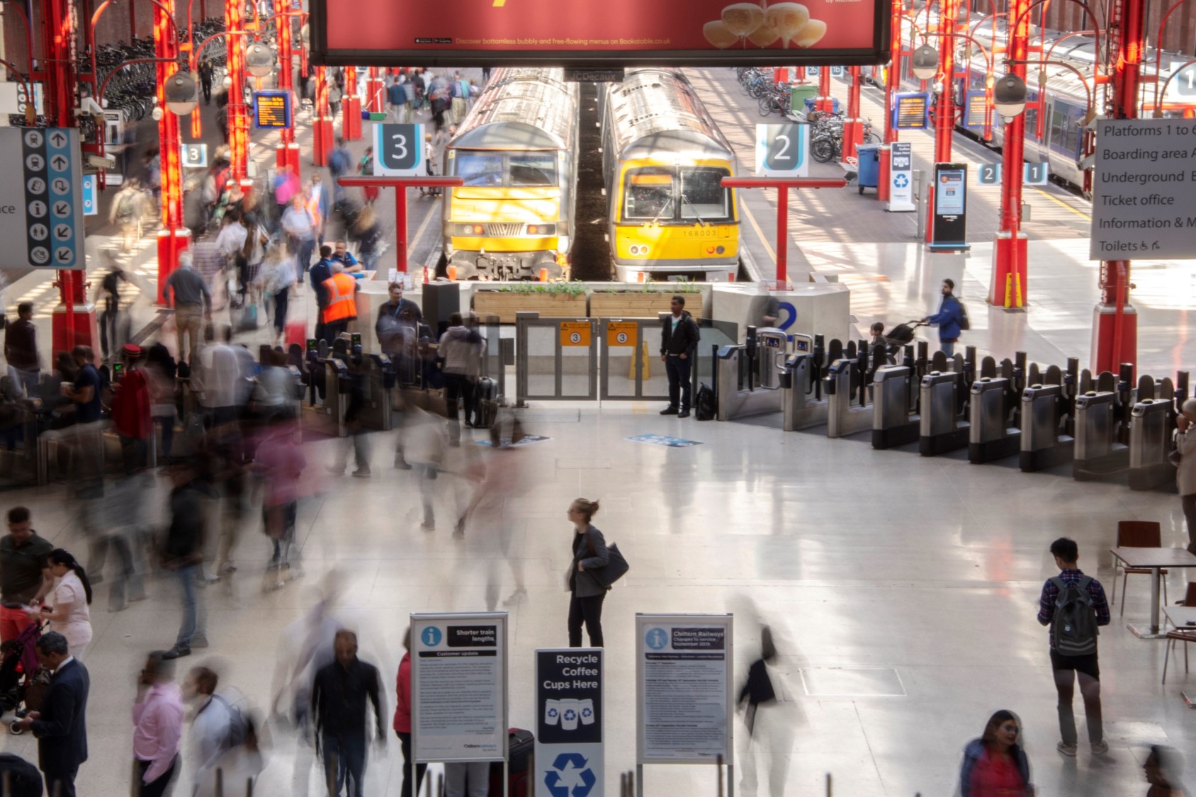 An image of Marylebone station with lots of customers boarding trains