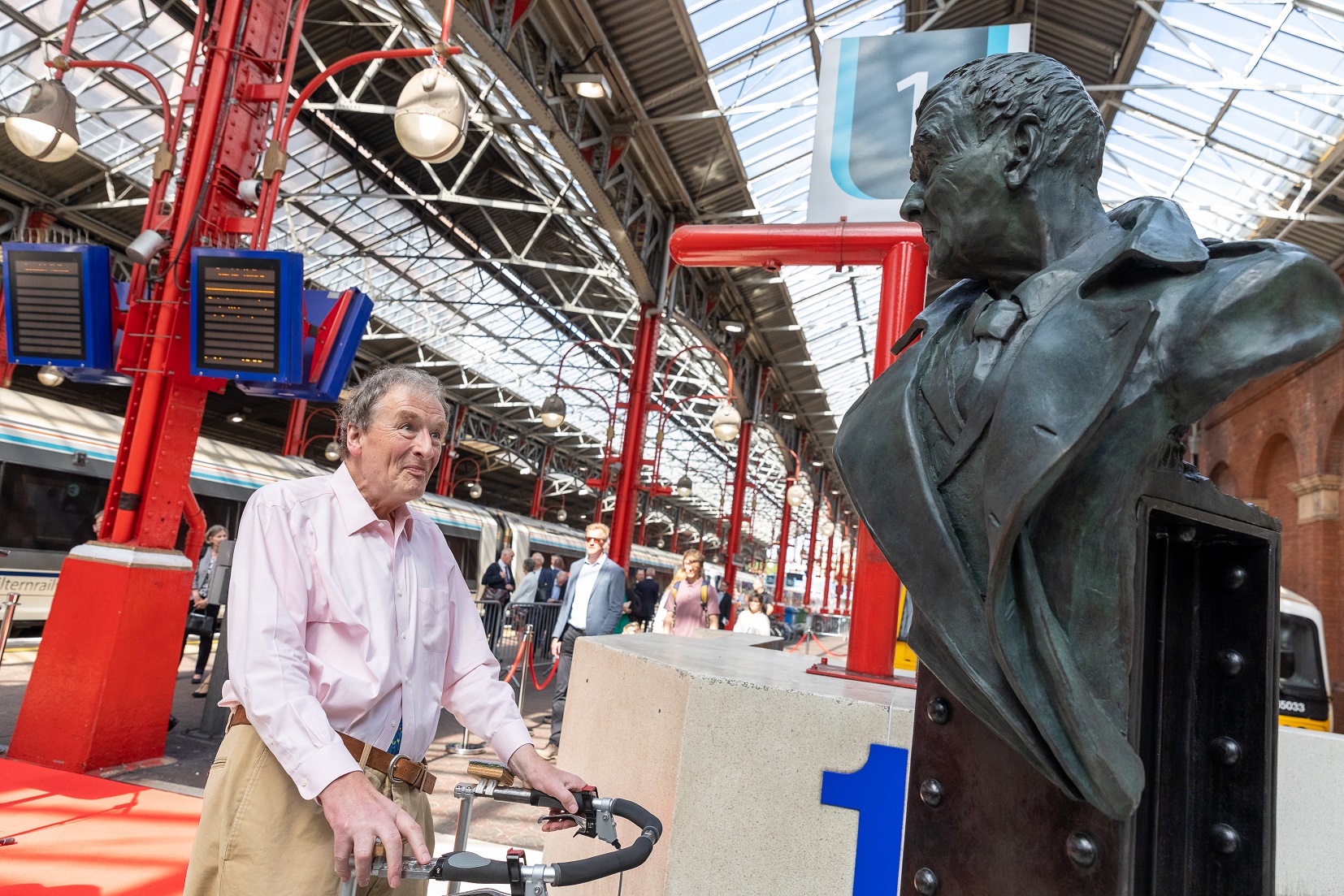 Adrian Shooter CBE with statue
