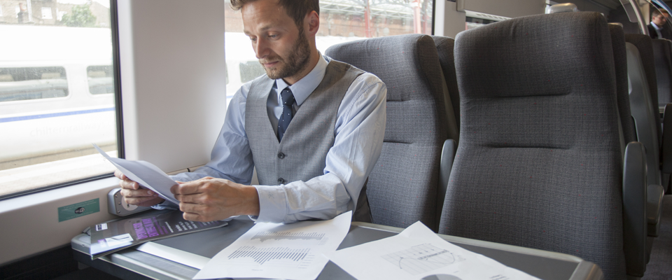 Image of business man working on Chiltern Railways train