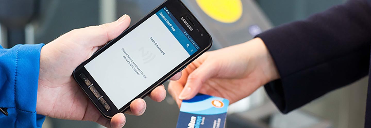 Smartcard ticket is checked by a ticket inspector