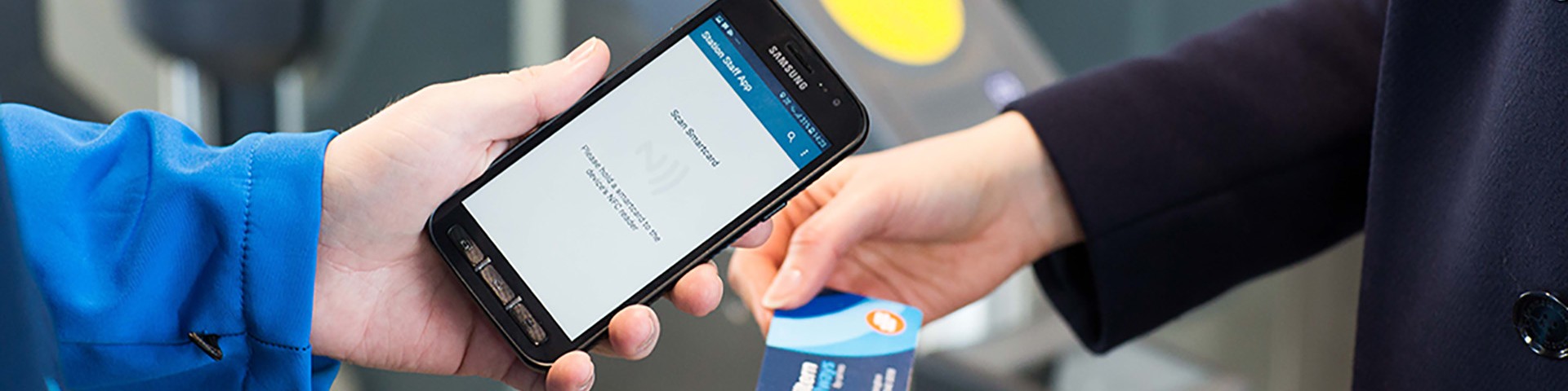 A smartcard ticket being checked by a ticket inspector