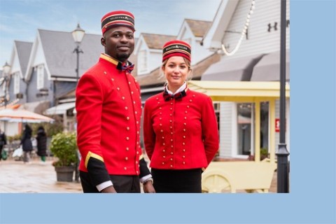 Two Bicester Village hosts standing together in Bicester Village